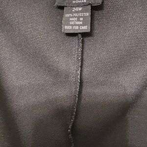 Black dress, 100% polyester, small slit in the back